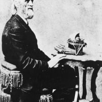 Portrait of Christopher Latham Sholes posing at a typewriter, n.d., Courtesy of the Wisconsin Historical Society, ID 3218.