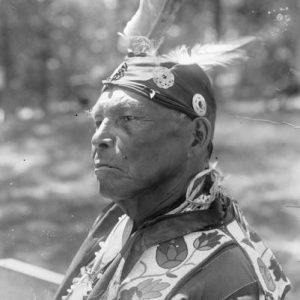 Quarter-length portrait of Simon Onanguisse Kahquados (1851-1930) of Forest County, Wisconsin, the last hereditary chief of the Potowatomi, n.d.  Image ID: 24373 Courtesy of the Wisconsin Historical Society.