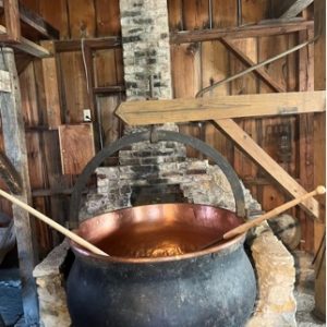 Copper kettle used for cheese making. Image courtesy of the Swiss Historical Village and Museum, New Glarus.