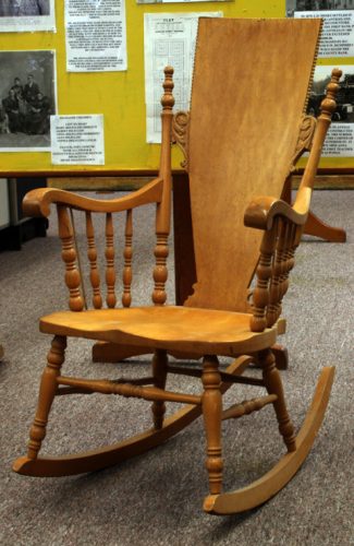 A wooden rocking chair.