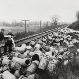 Farmers dump milk taken from a train that was shipping dairy products near Burlington, WI. Wisconsin Historical Society Archives, Image ID 2038.