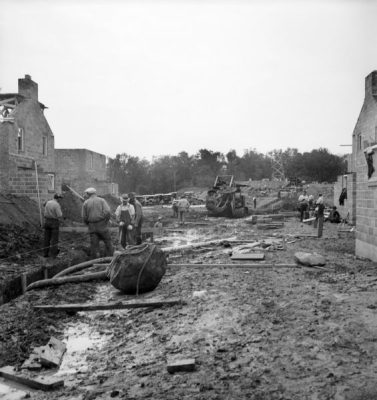 At Greendale, men level ground for construction, circa 1937. Photograph by Raymond J. Miller, from the Wisconsin Historical Society, image #63740.