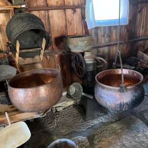 Smaller kettles used for cheese making. Image courtesy of the Swiss Historical Village and Museum, New Glarus.
