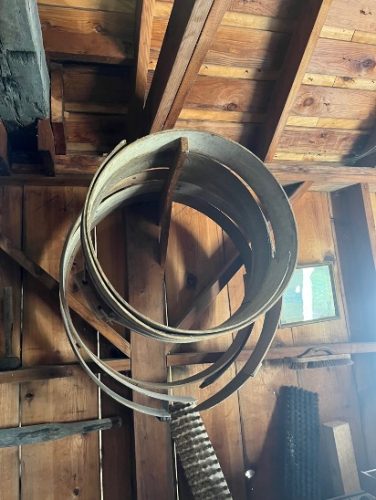 Wooden hoops hung on a post.